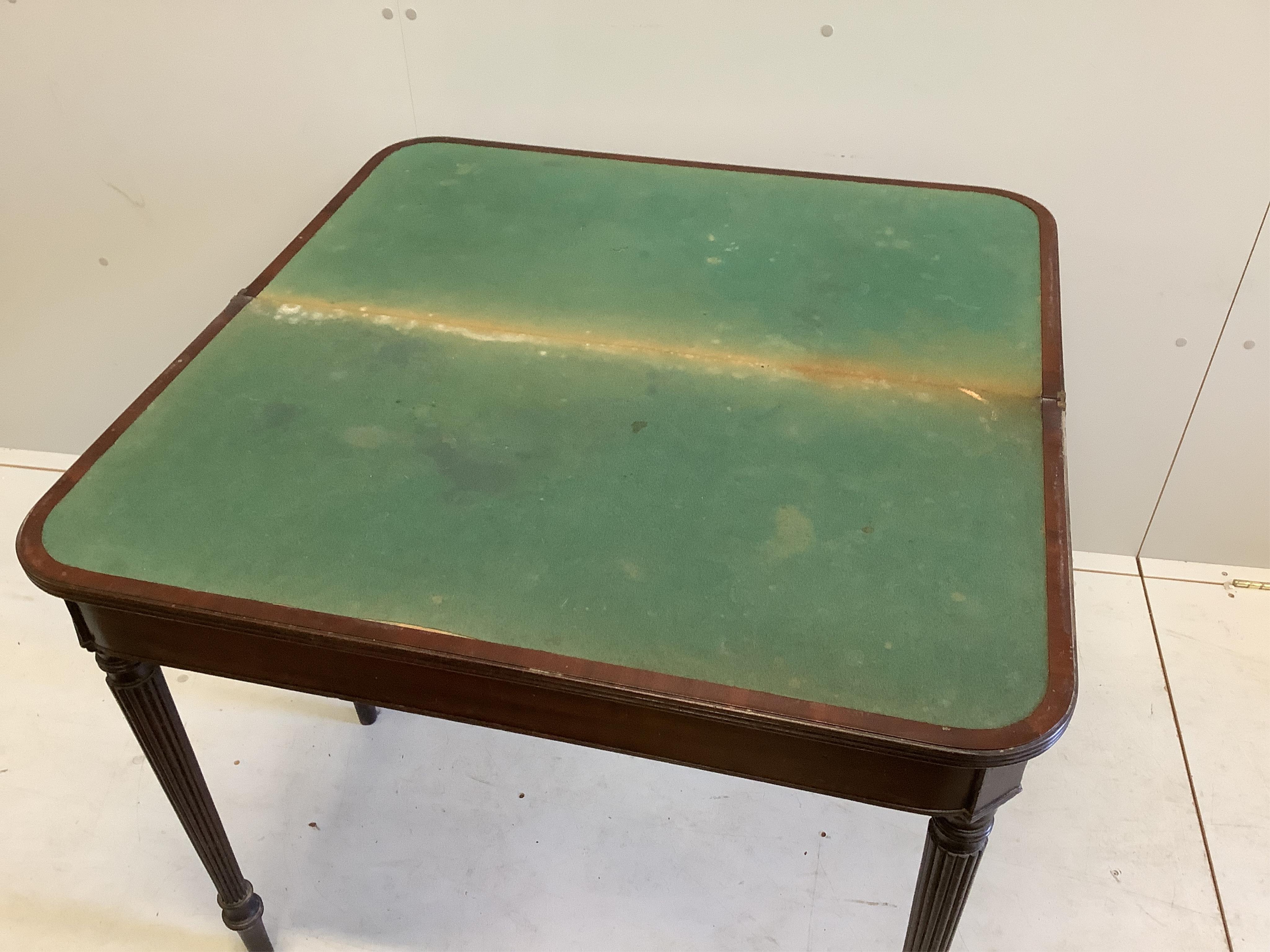 A Regency mahogany folding card table, width 92cm, depth 46cm, height 76cm. Condition - fair